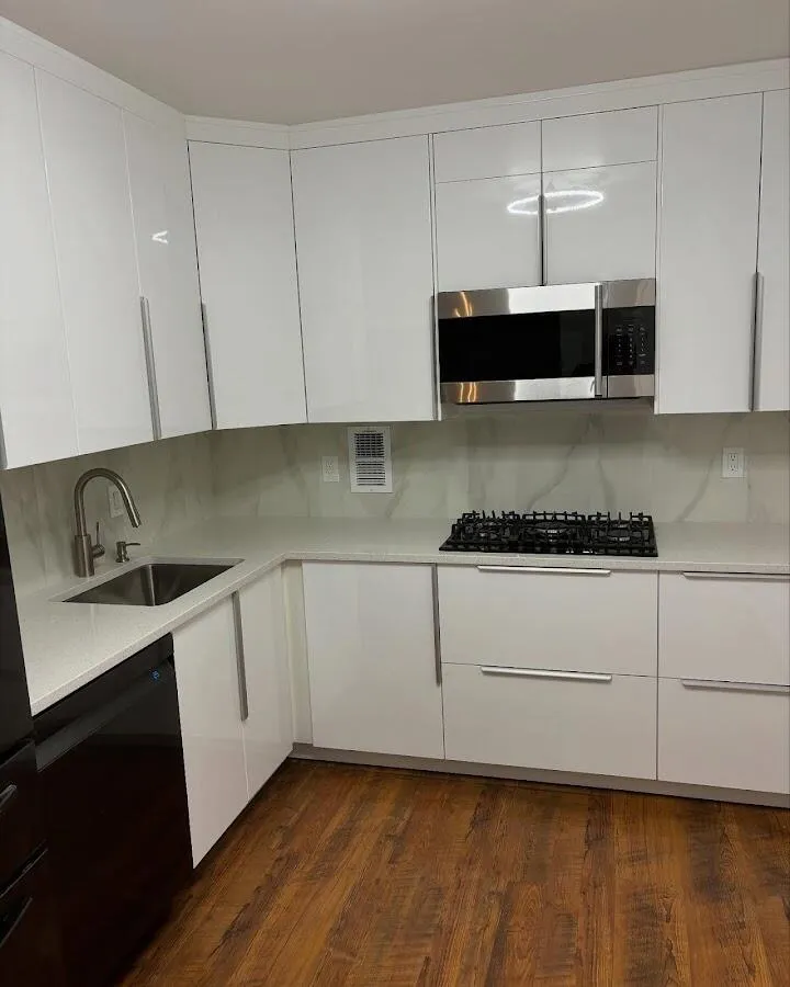 Restored kitchen with white cabinets after water damage in Burke Centre